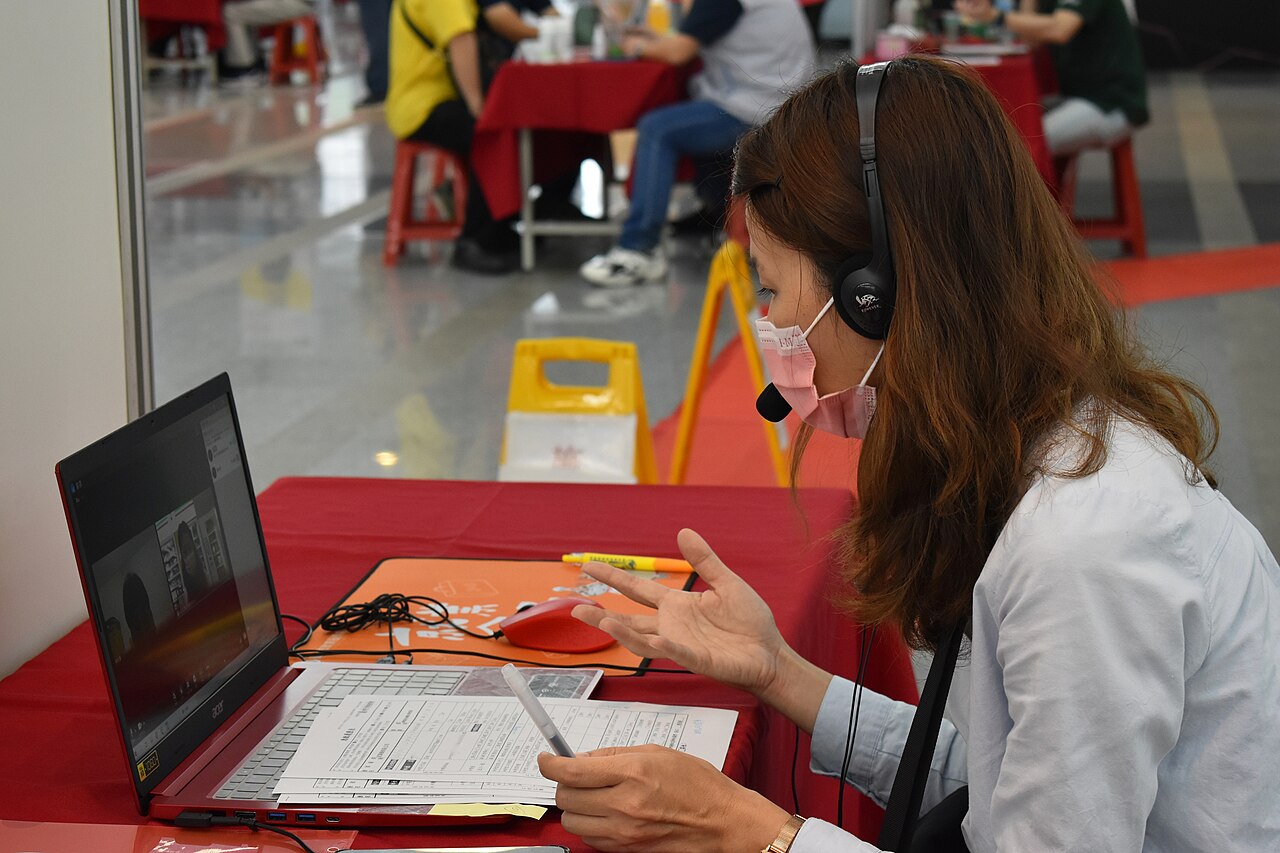 A candidate taking part in a video interview on a laptop
