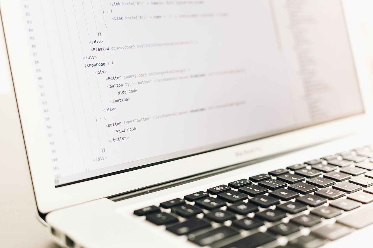 A laptop screen showing lines of code, an example of digital skills employers want