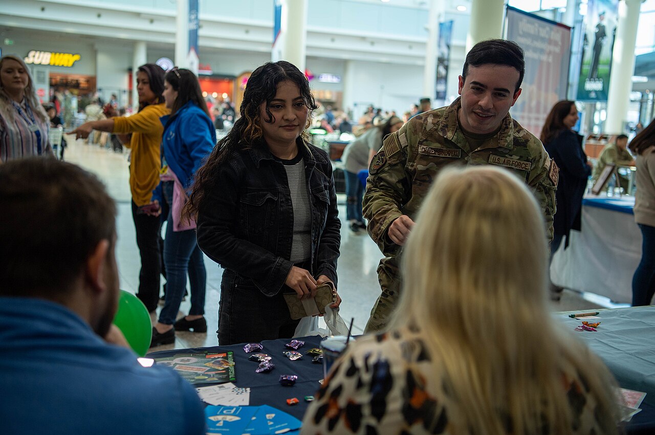 Job seekers talking with employers at a job fair