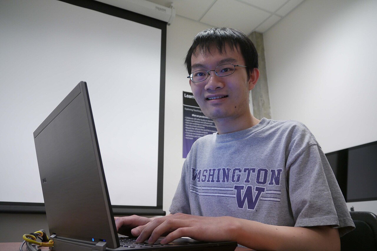 A student using a laptop to search for scholarships online