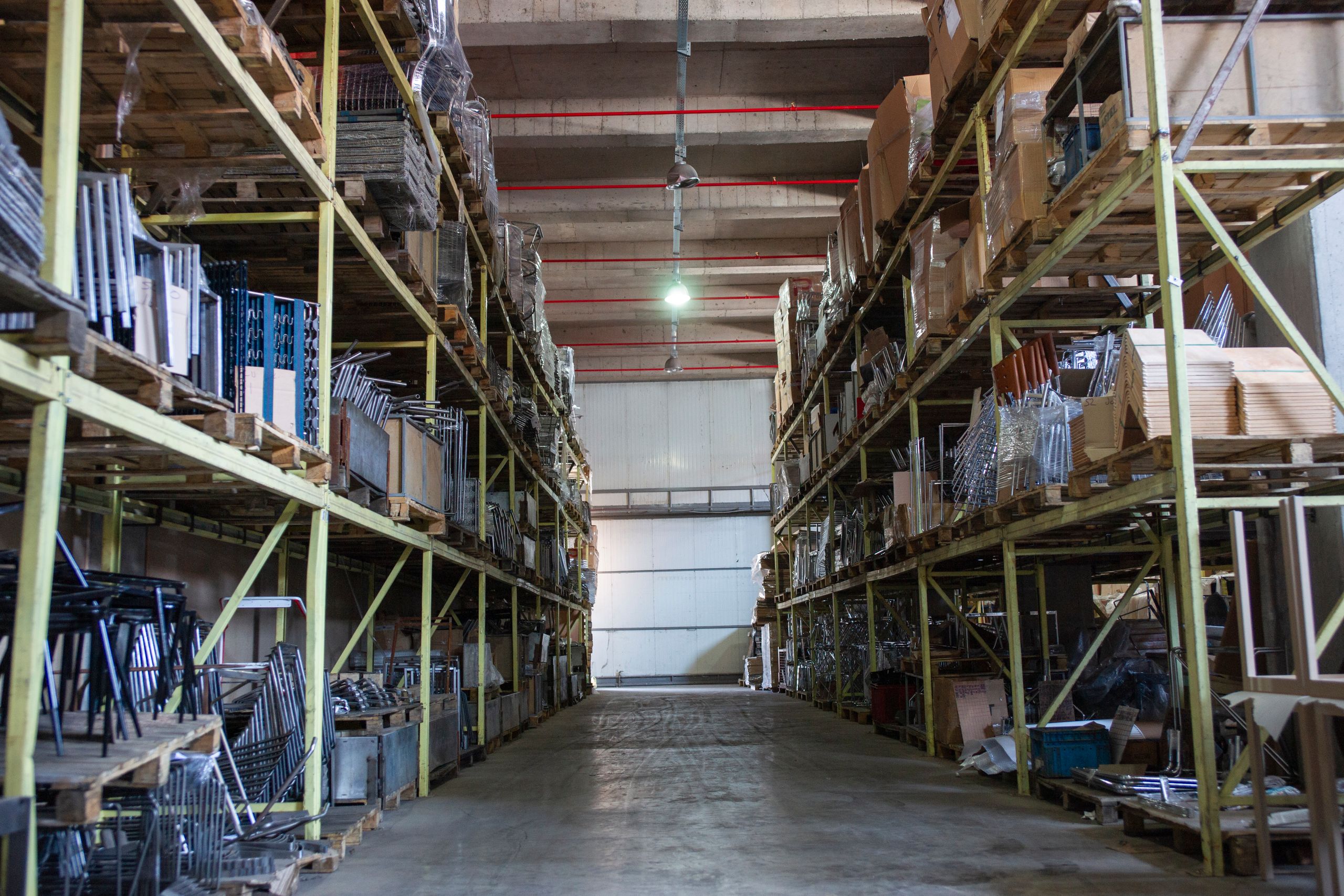 warehouse jobs — tall racking aisles inside a distribution centre